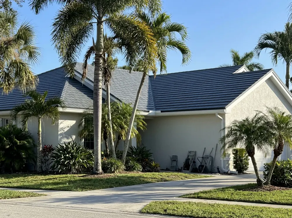Dark gray painted steel shingle panels on a single-story Florida home
